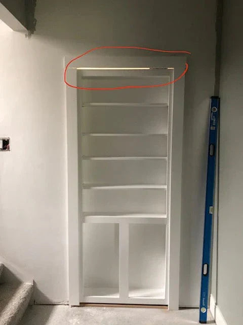 gap at the top of a hidden door