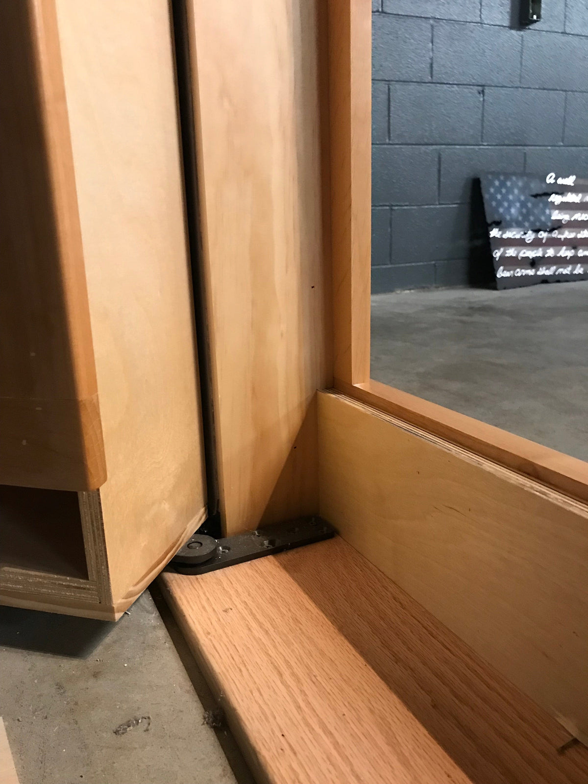 Cutaway view showing Alpha concealment door lower step-over design