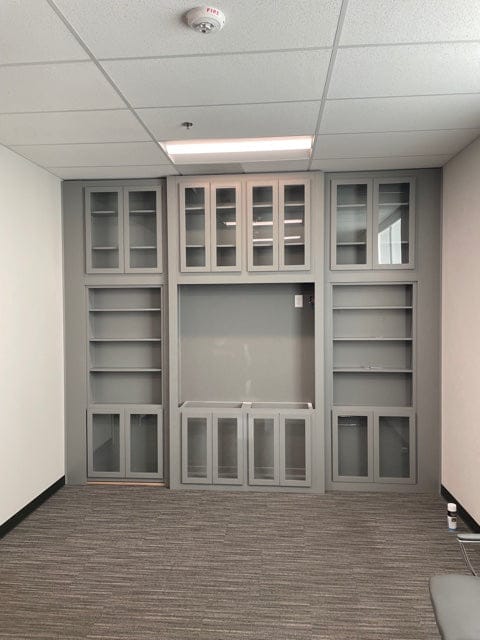 Custom wall unit with concealed bookcase door closed