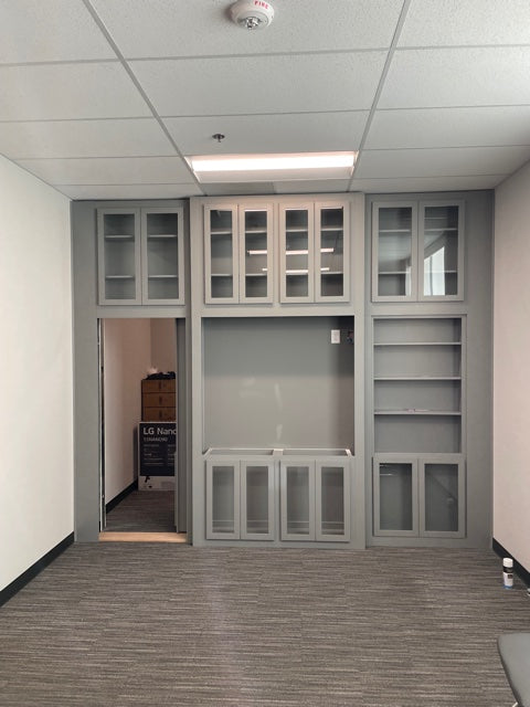 Custom wall unit with concealed bookcase door open