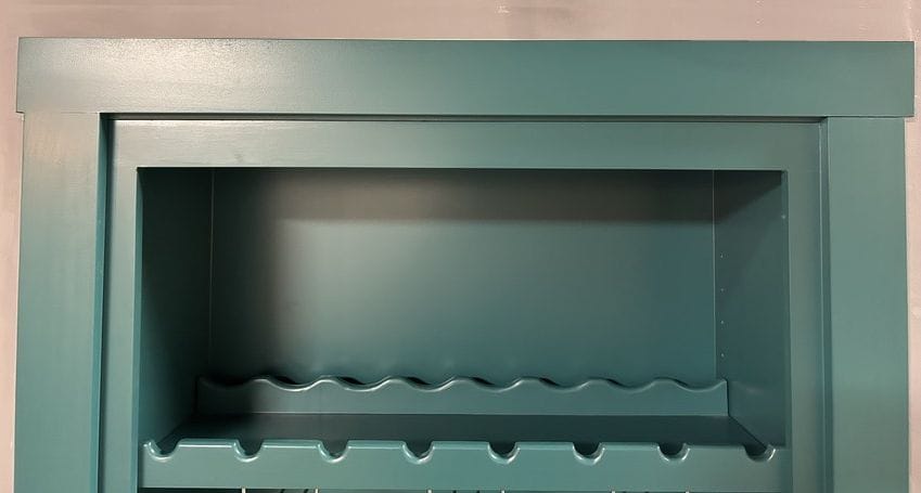 TopSeal installed above an out-swing hidden door