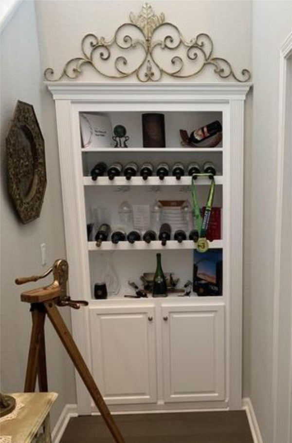Fully stocked wine rack hidden door
