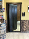 Hide-A-Way-Doors double sided hidden door in dark wood with a mirror panel installed in a rustic interior