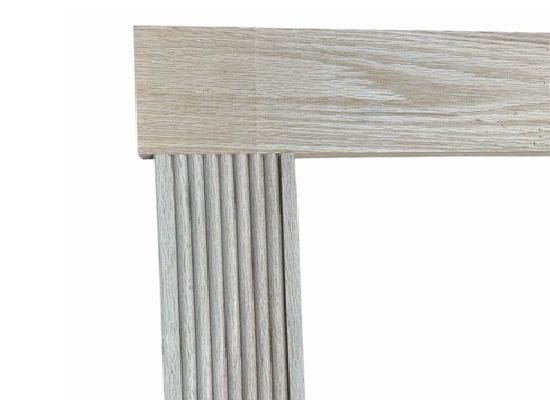 Fluted vertical trim with flat top case on a hidden door