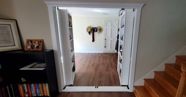 Double hidden bookcase door with both doors fully open