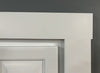 White rear case molding for hidden doors installed around a white door frame corner