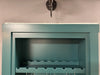 Hidden door frame showing hidden door top seal for out-swing doors in teal blue finish