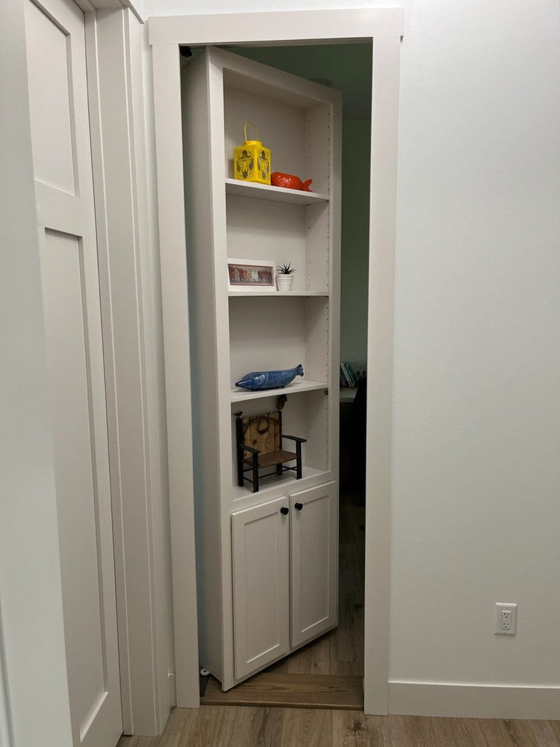 White in-swing Standard Hidden Bookcase Door installed in a finished interior