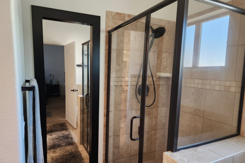 Hidden mirror door with black trim