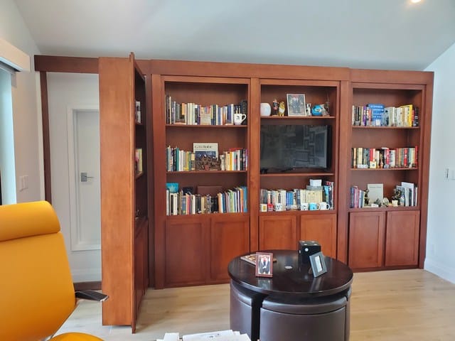 hidden door wall unit open