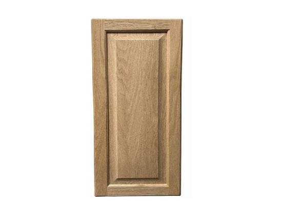 Raised panel cabinet doors installed on a hidden bookcase door