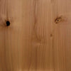 Close-up of natural wood grain showing real wood hidden door materials with knots and smooth texture