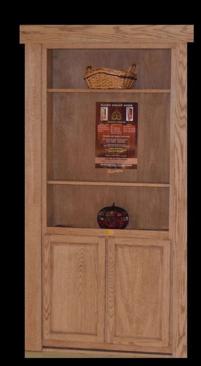 Stationary hidden bookcase door by Hide-A-Way-Doors in natural wood finish with shelves and cabinet