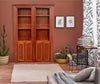 Hide-A-Way-Doors wooden hidden bookcase door with shelves in a cozy living room setting