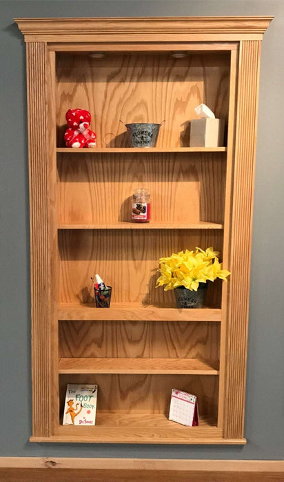Hide-A-Way-Doors wooden hidden bookshelf door with shelves displaying decorative items and flowers
