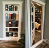 Hide-A-Way-Doors hidden bookshelf door blending seamlessly with wall and showing storage behind