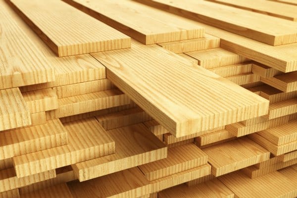 Stacked real wood prepared for hidden door construction