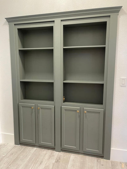 Gray wooden French bookcase hidden door with shelves and cabinetry by Hide-A-Way-Doors