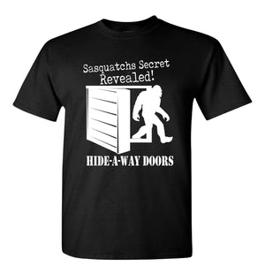 Black Sasquatch secret t-shirt with white graphic of Bigfoot behind a hidden door from Hide-A-Way Doors