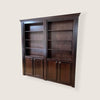 Hide-A-Way-Doors dark wood hidden bookcase door with shelves and cabinet storage